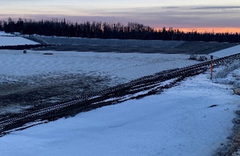 Winter installation of geosynthetics with layer completion each day